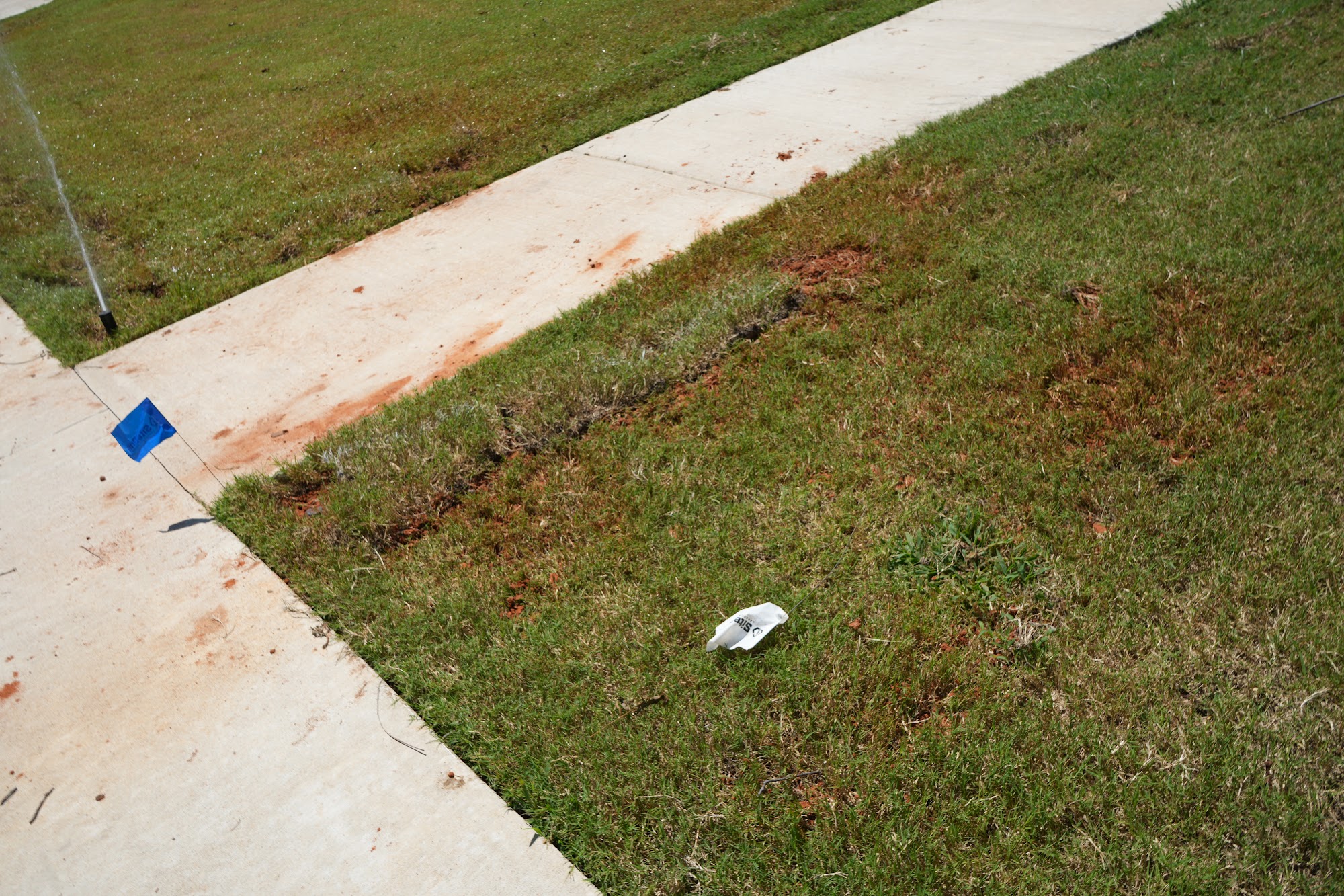 All Star Sprinkler Systems crew marking an irrigation layout